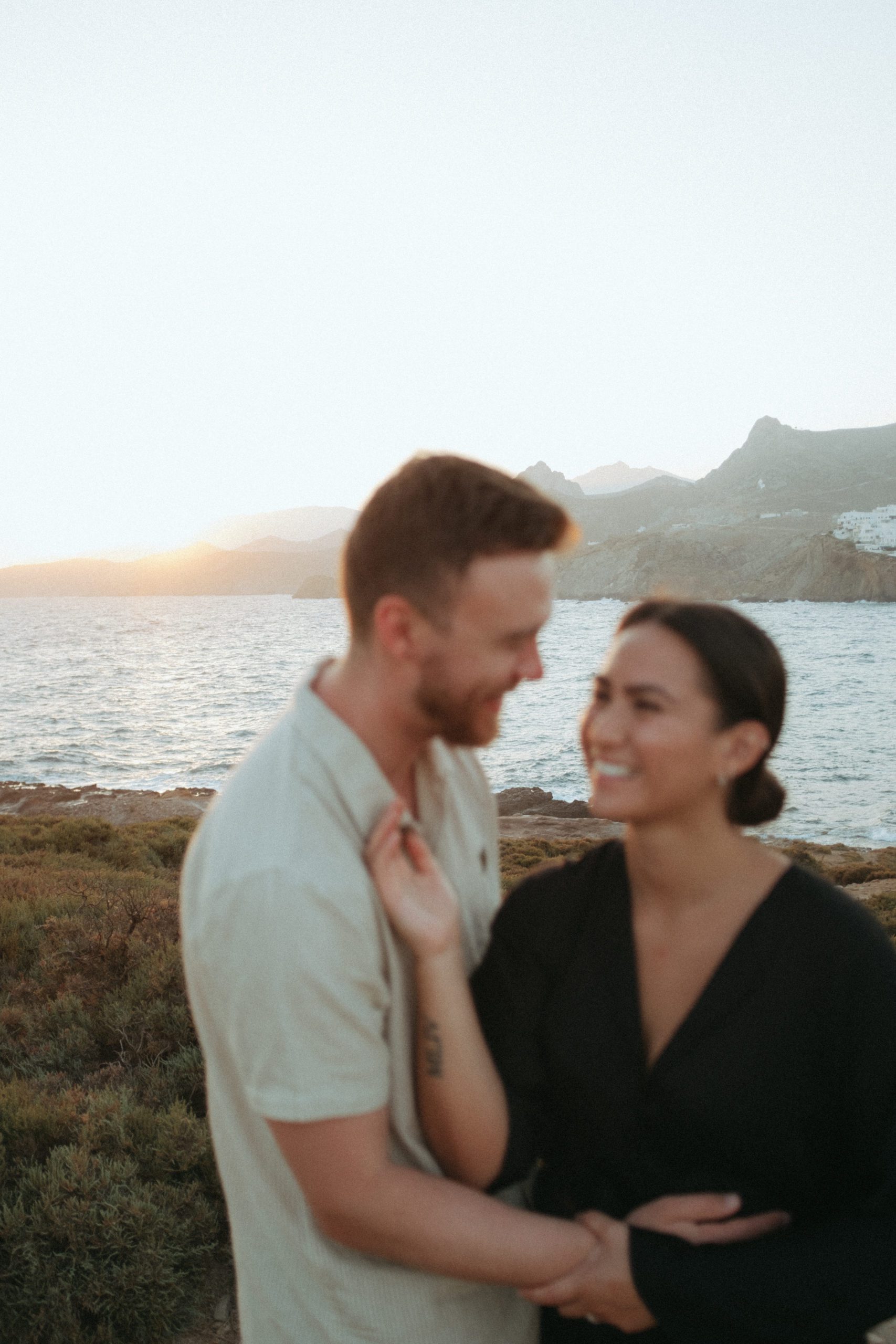 Couple laughing with each other in Greece