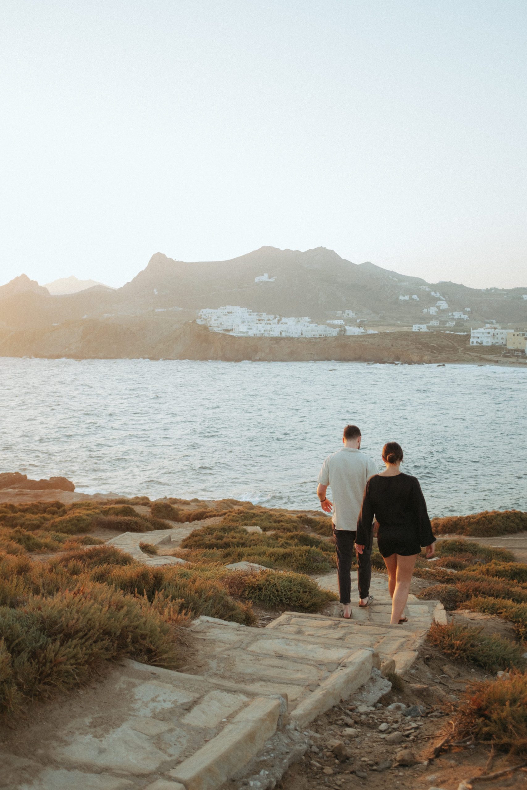 Couple walking on the coast of Greece
