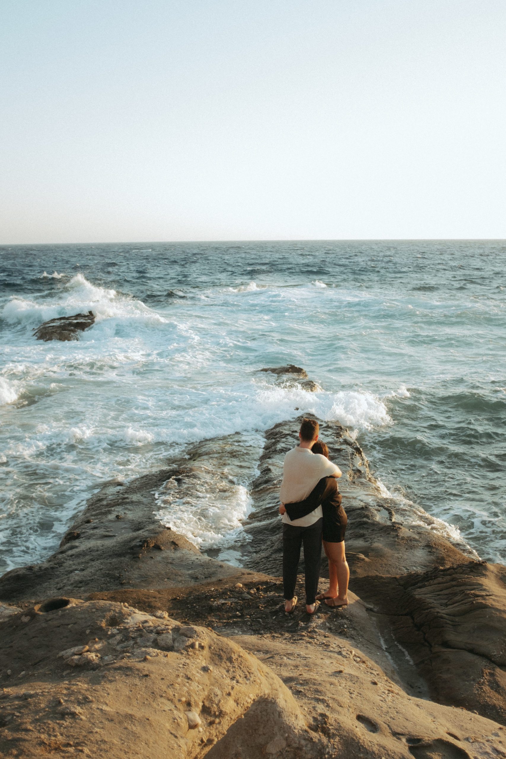Couple hugging on the coast of Greece 