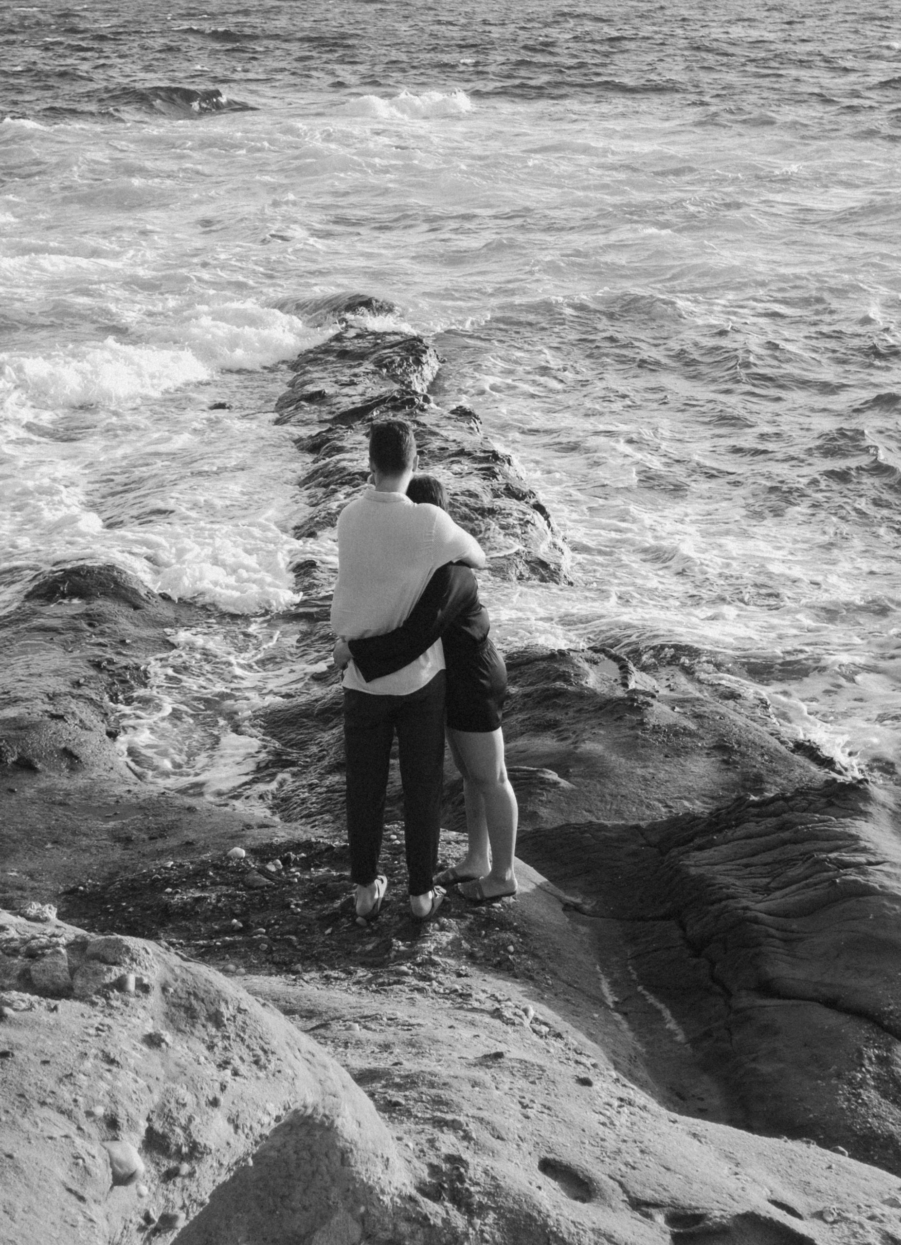 Couple hugging on the coast of Greece