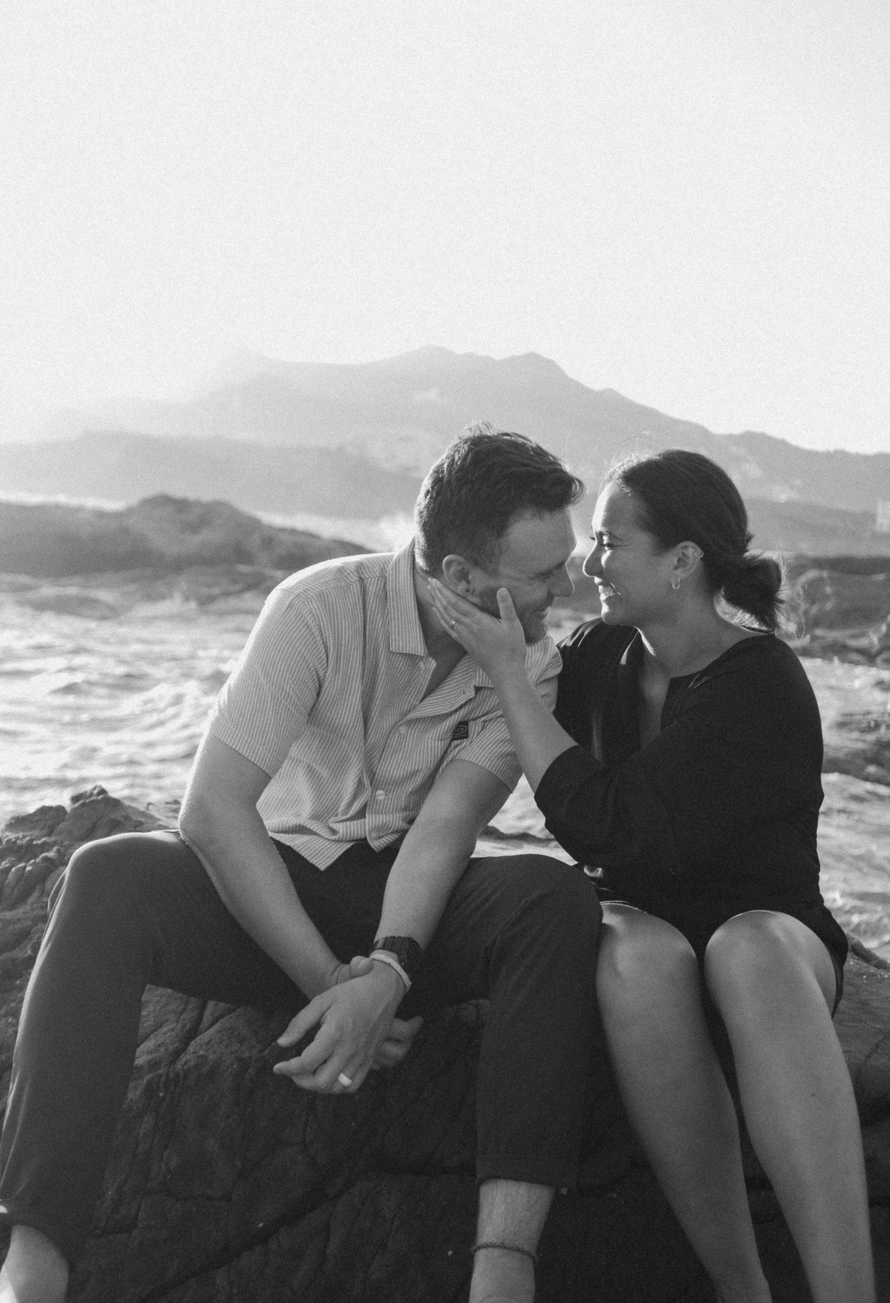 Couple laughing on the coast of Greece