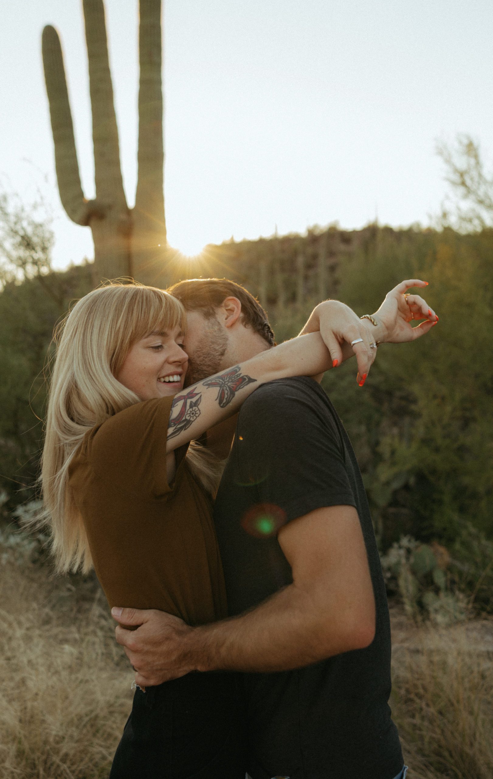 couple hugging in desert