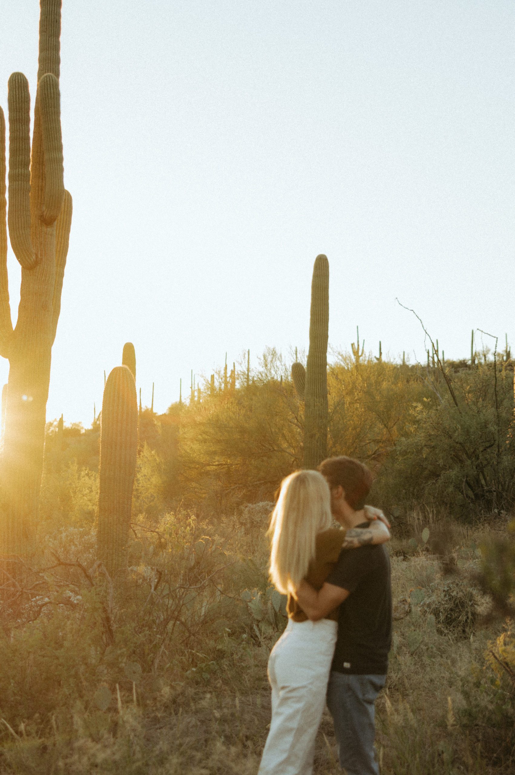 couple hugging in desert