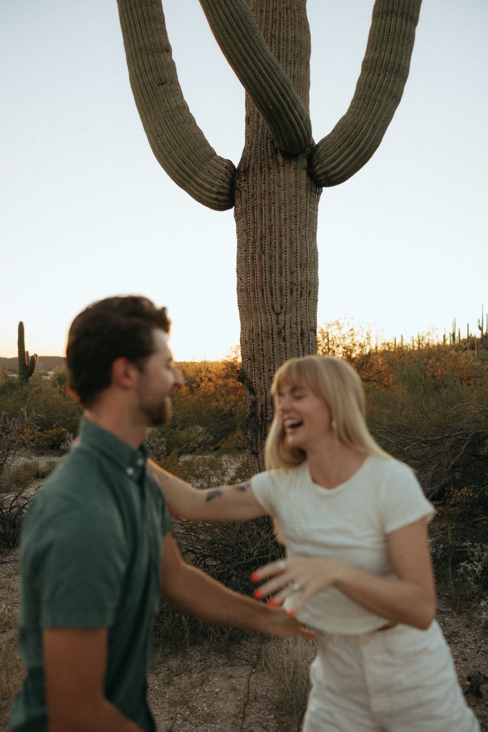 couple laughing in desert
