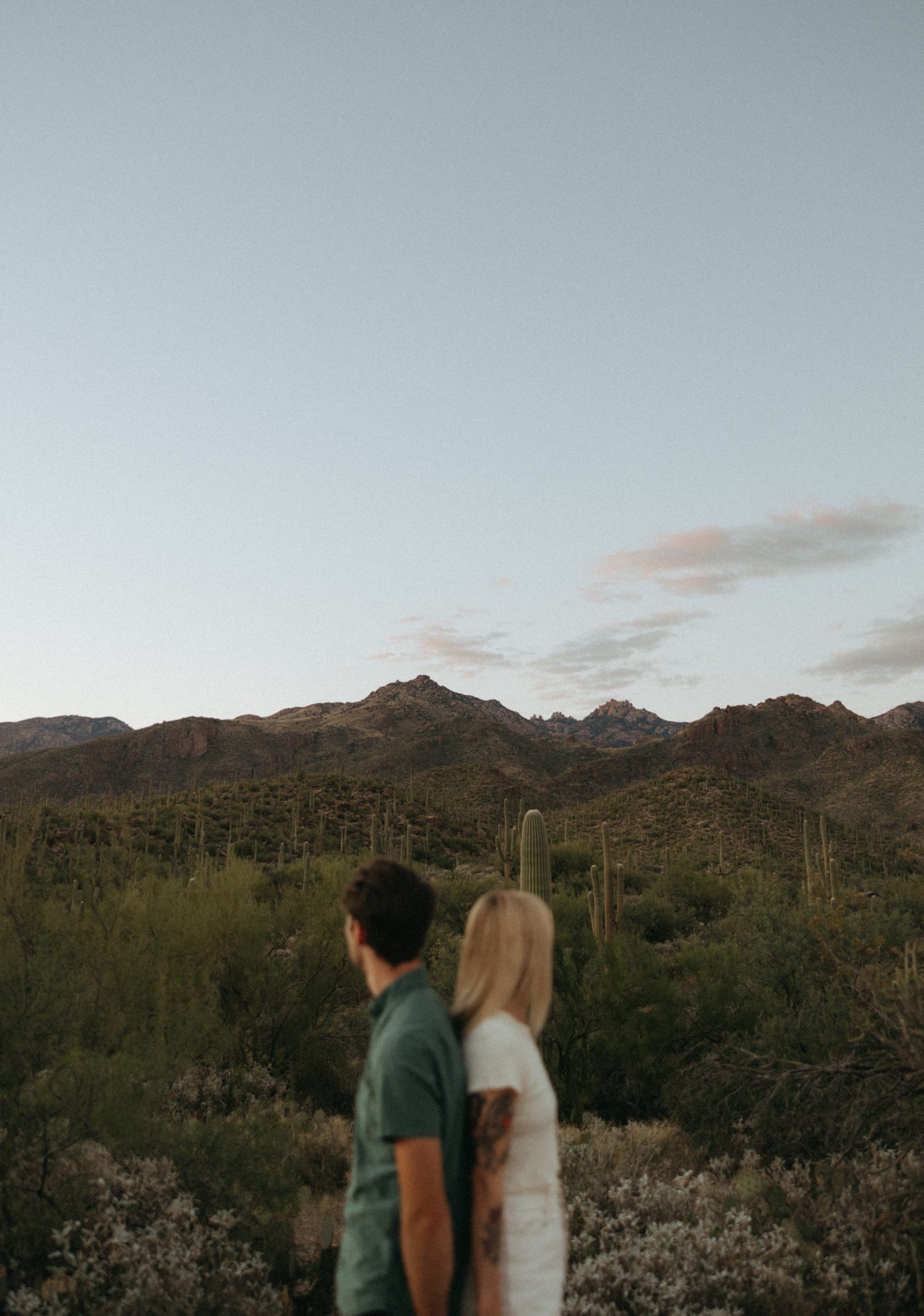 couple standing looking at mountain