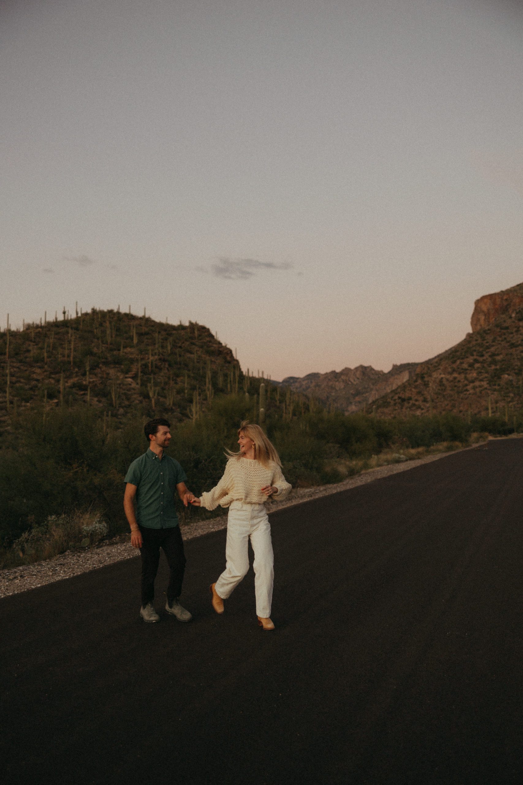 couple crossing in desert