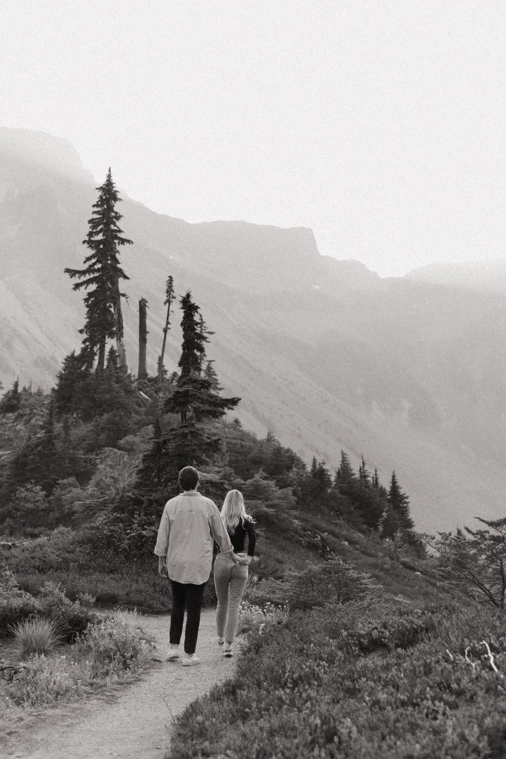 Couple in the north cascade mountains walking away