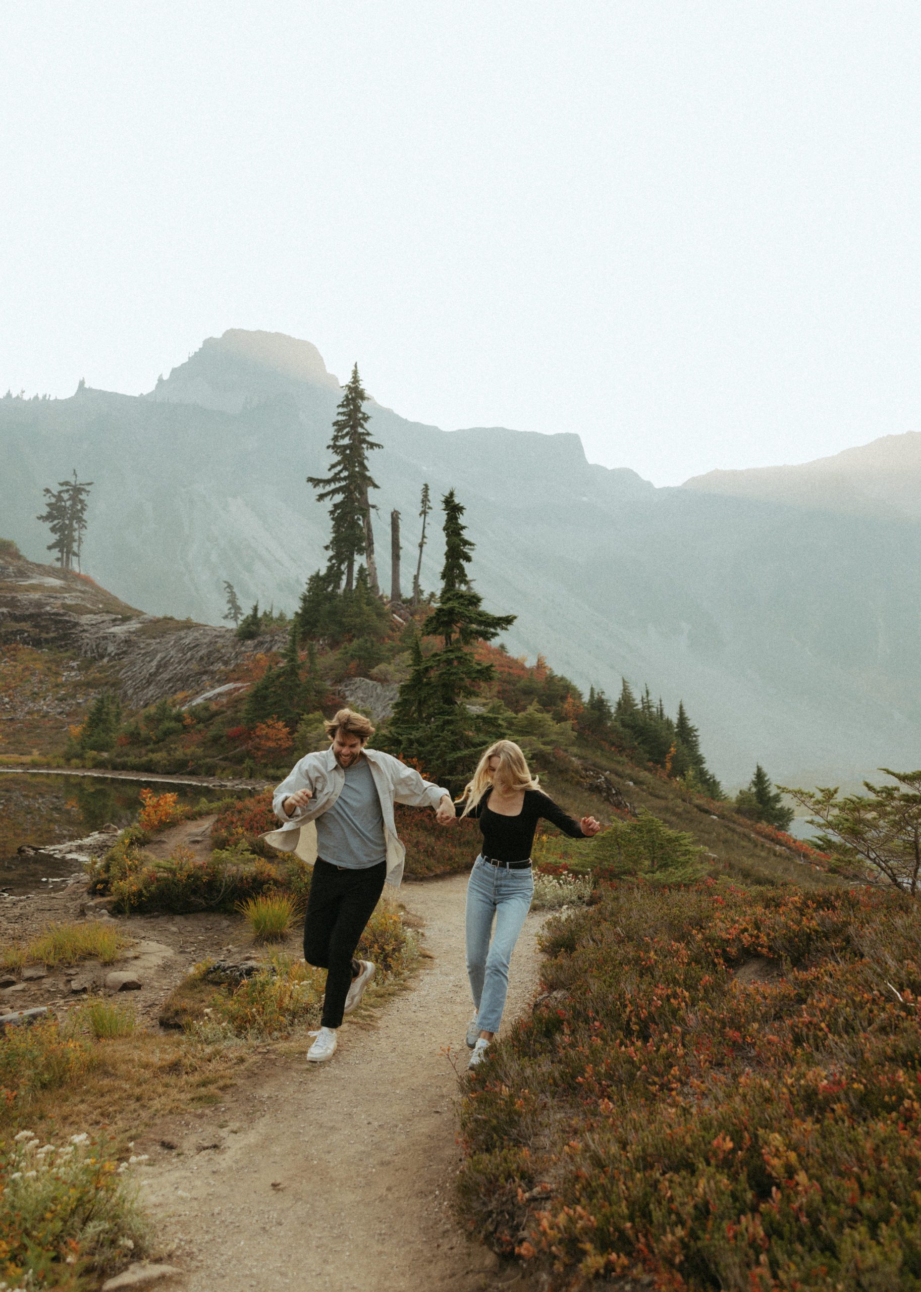 Couple in the north cascade mountains running