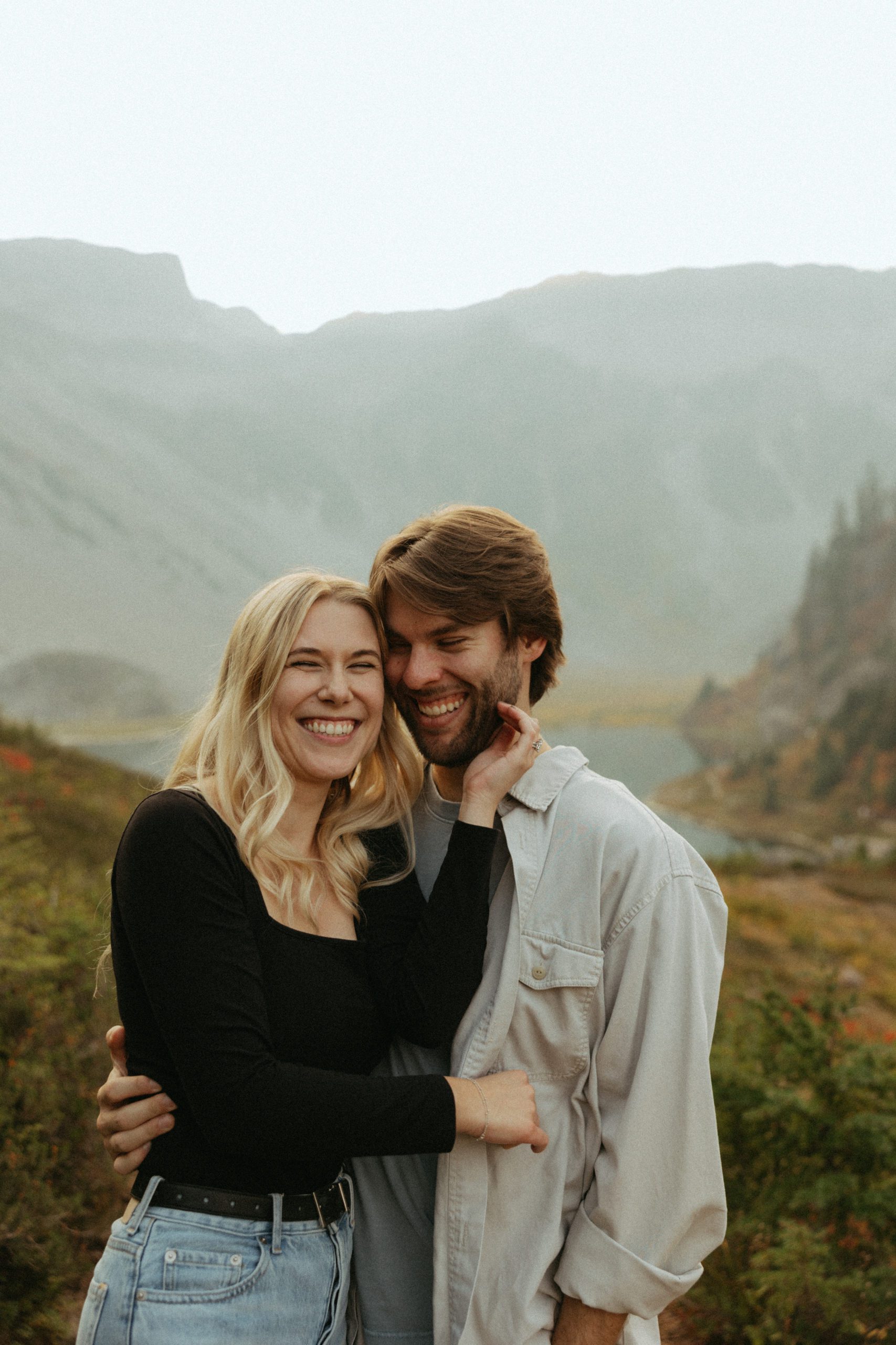 Couple in the north cascade mountains laughing